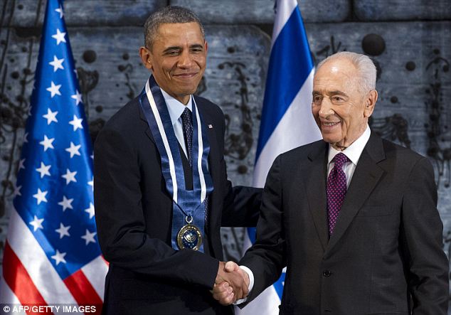 Shimon Peres awards Barack Obama with Medal