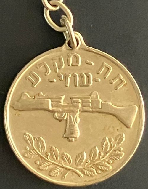 Gil-Tex medal with Uzi